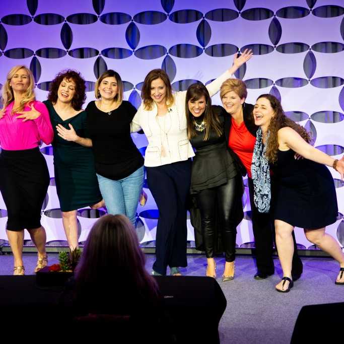 Nina speaking in front of live audience